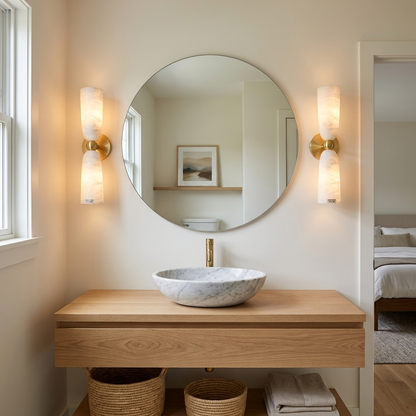 Alvane double bell alabaster wall sconce in gold &amp; white in a bathroom in a suburban house in Columbus, Ohio