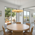 Almira alabaster halo ring chandelier, single ring brass, in a suburban dining room in San Diego, California