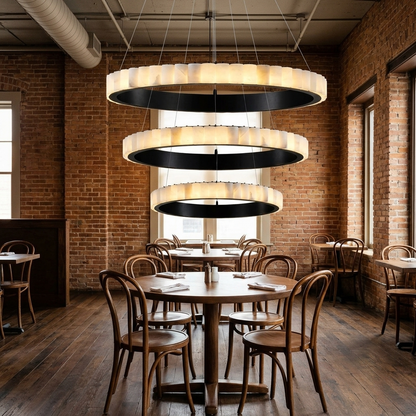 Almira alabaster halo ring chandelier, three rings black, in an empty restaurant in Kansas City, Missouri