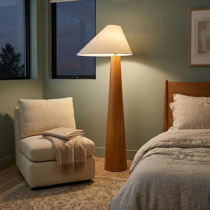 Ursule Organic Wood Floor Lamp with Linen Shade in a bedroom reading corner